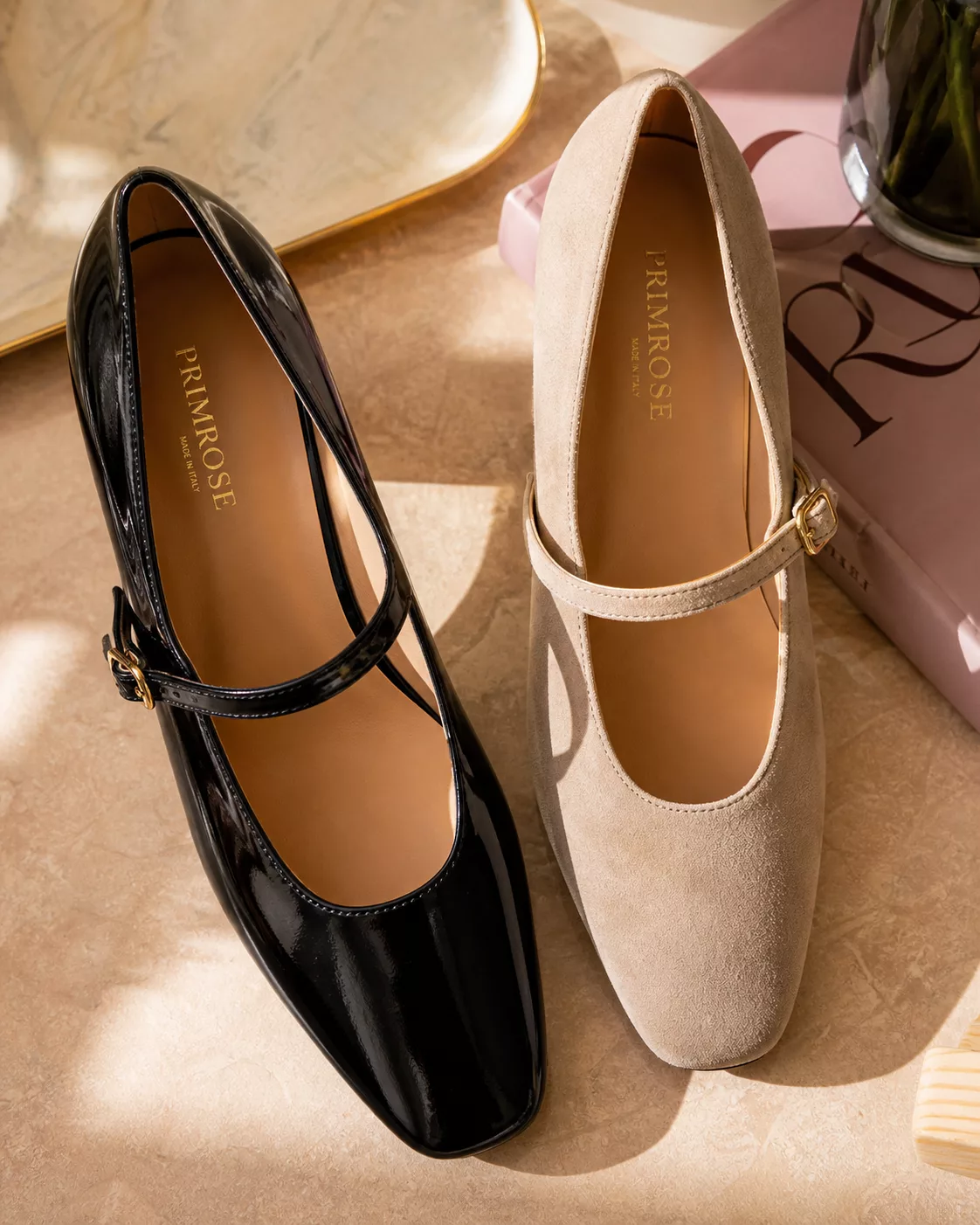a beautiful close-up flat-lay of classic Mary Jane shoes in black patent